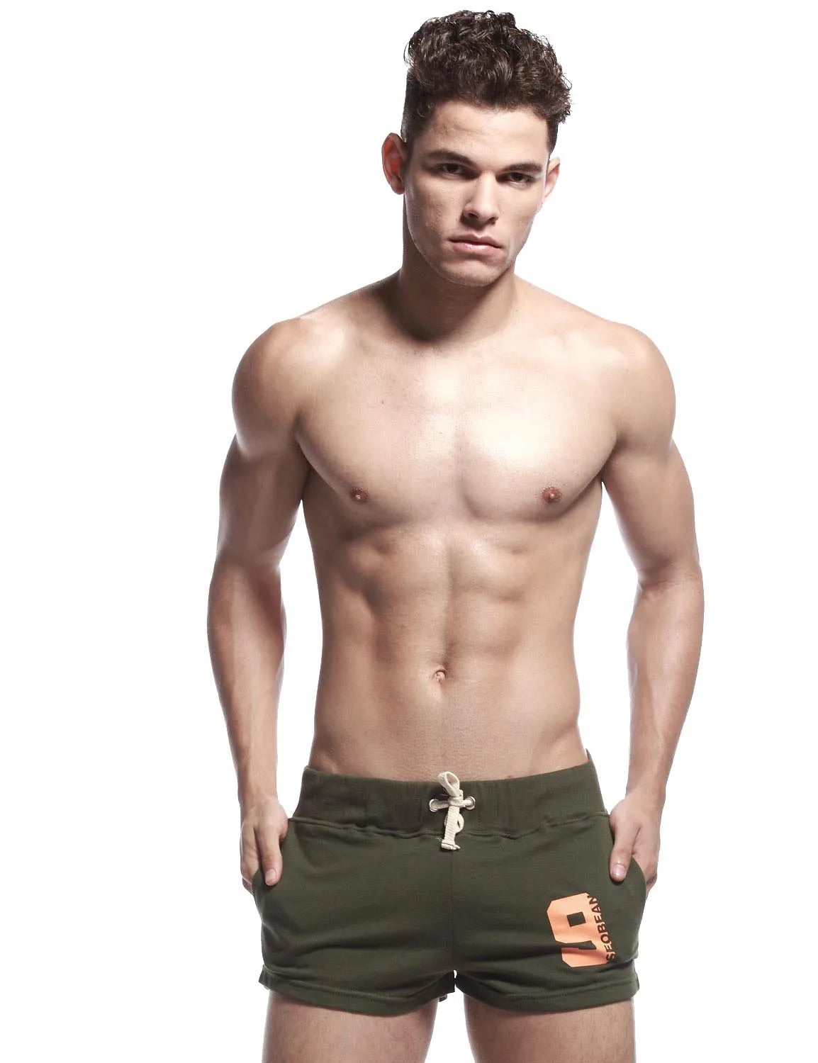 Close-up front view of army green sport shorts with drawstring waist and orange number 9 print