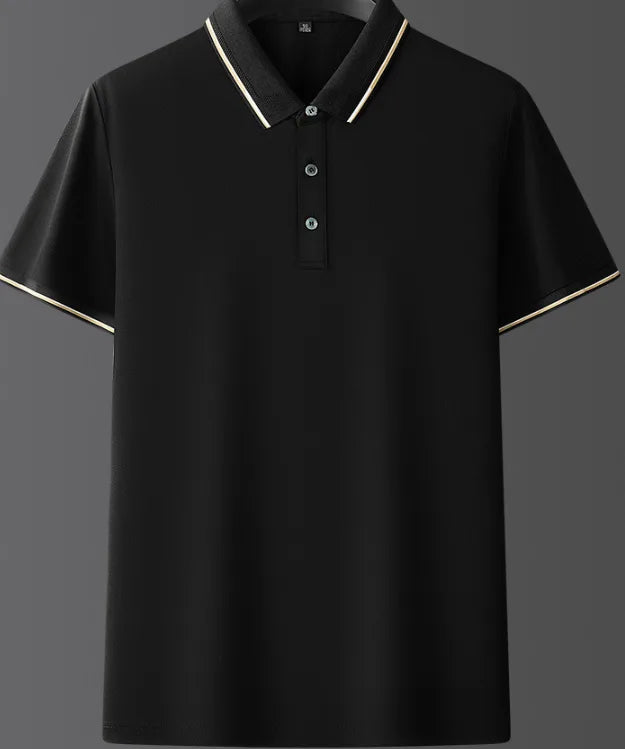 Front view of black polo shirt on a hanger, highlighting the ribbed collar with gold and white trim