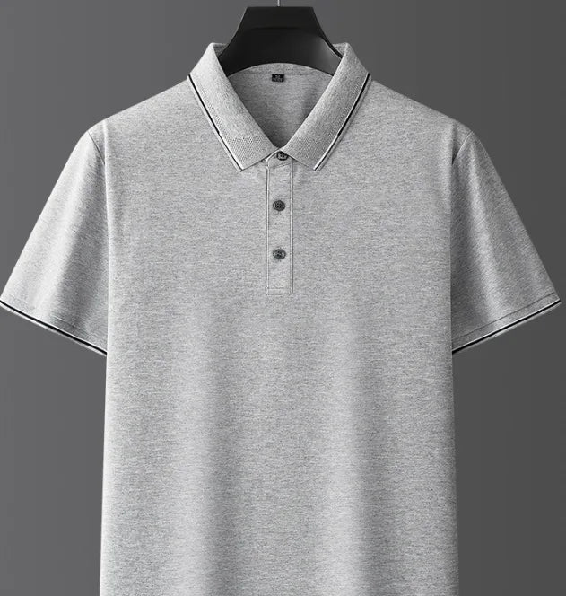 Close-up of light grey marle polo shirt collar and button placket on a hanger