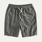 Charcoal grey drawstring shorts flat lay with visible back-pocket brand tab and cream tie cord
