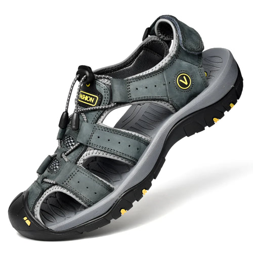 Side angle of a grey leather closed-toe sandal showing the chunky lugged outsole and mesh side vents
