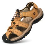 Tan leather fisherman-style sandal with contrast stitching, bungee cord closure and rugged tread sole