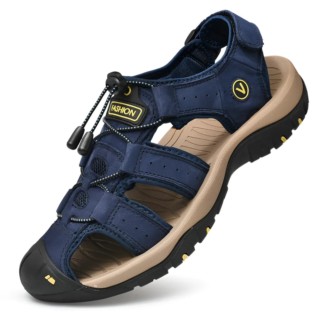 Navy leather sandal with adjustable ankle strap, toggle lace lock and tan cushioned footbed
