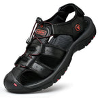 Black leather closed-toe sandal with red accent stitching and durable rubber traction outsole