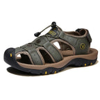 Olive green leather sandal with fabric trim, toggle closure and two-tone brown midsole