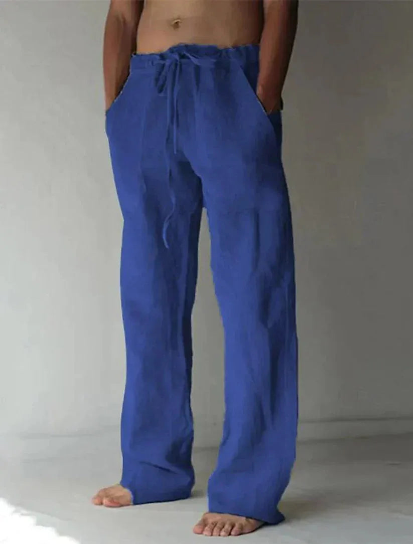Full-length front view highlighting the wide straight hem and loose silhouette of the linen pants