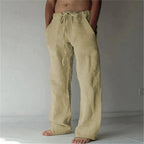 Khaki beige linen drawstring pants with a loose straight-leg cut, styled with no footwear