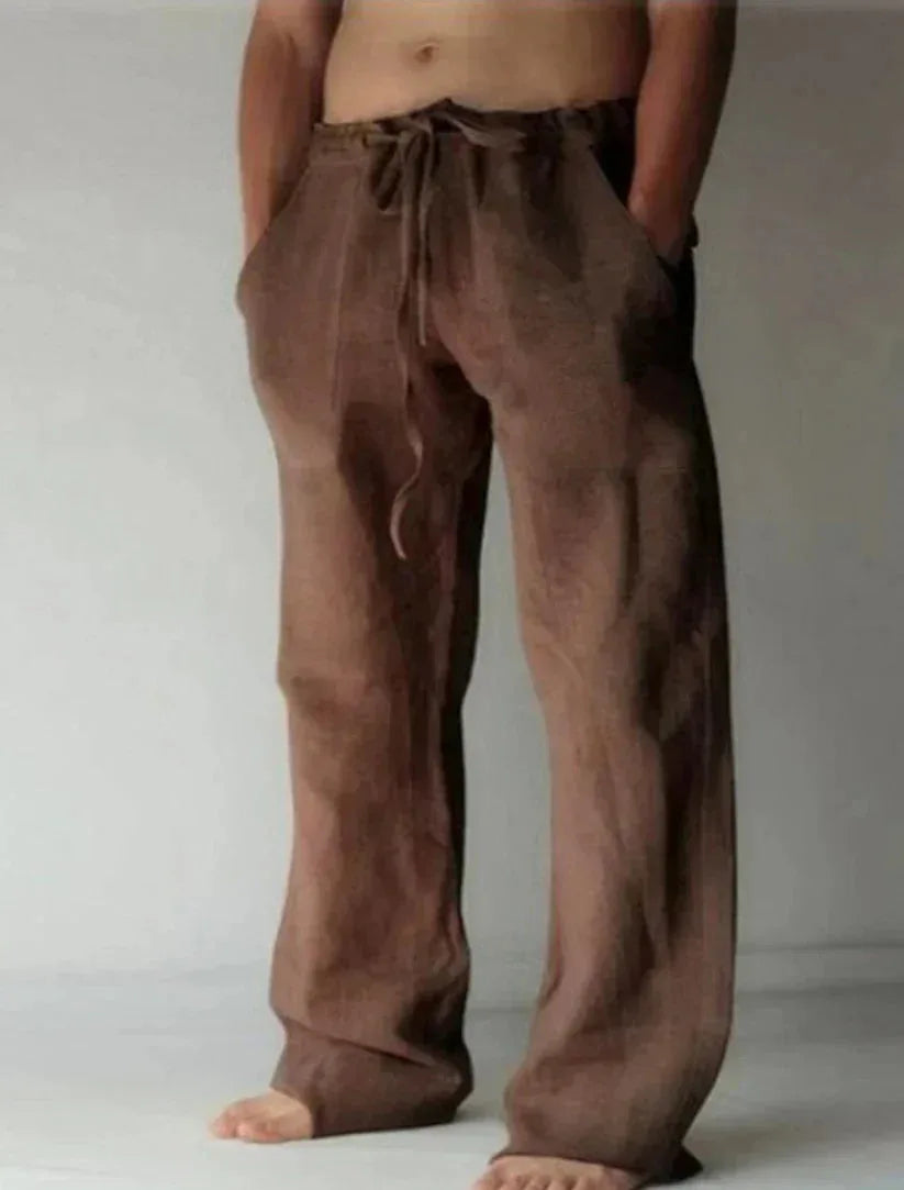 Dark brown linen drawstring pants shown from the front with relaxed wide-leg silhouette