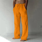 Bright orange linen drawstring pants with a loose fit and drawstring waistband, full front view
