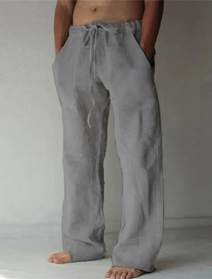 Light grey linen drawstring pants with a relaxed wide-leg cut and elastic drawstring waist