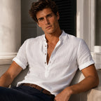 Close-up front view of the white linen shirt highlighting the button placket and soft woven texture