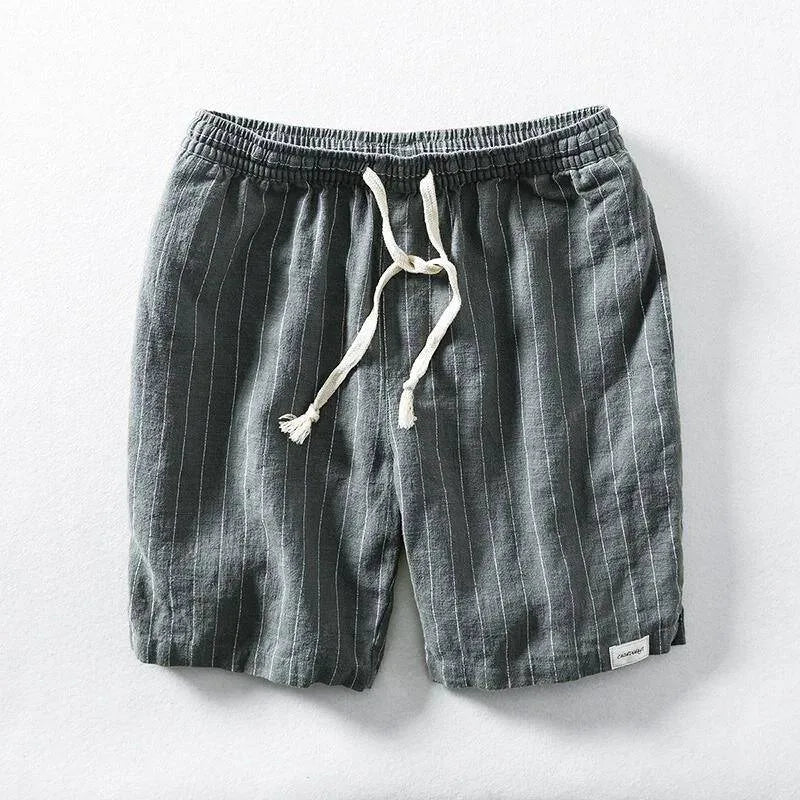 Grey pinstripe linen-blend shorts with white drawstring, flat lay on neutral background