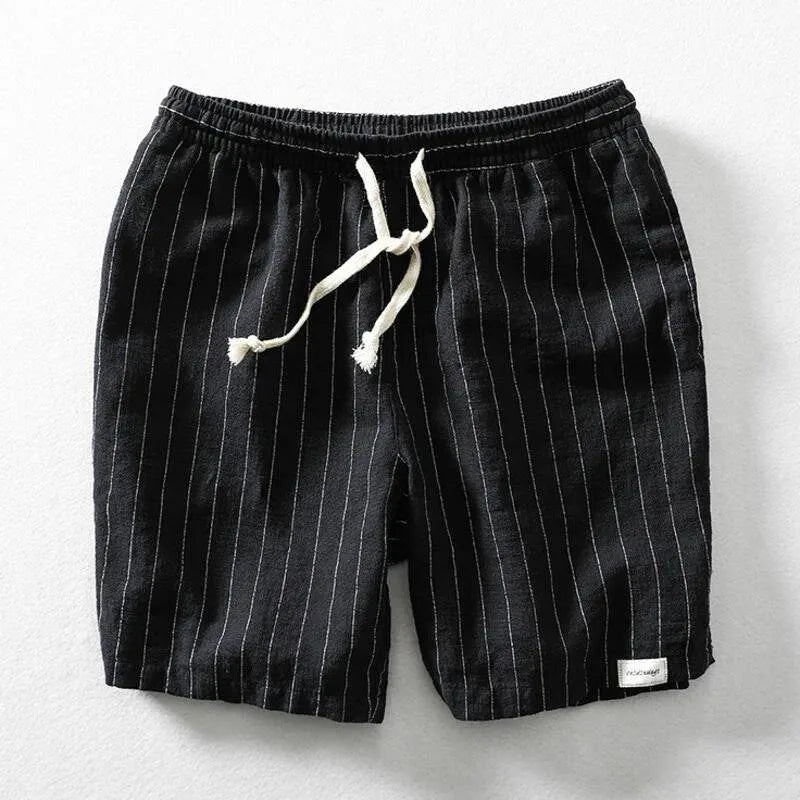 Black pinstripe linen-blend shorts with white drawstring cord, flat lay view