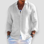 Close-up front view of a white linen-blend shirt with button placket open at the collar and relaxed fit