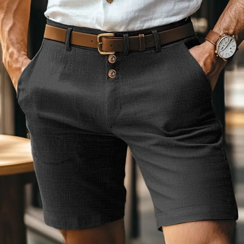 Front view of black linen-blend shorts with brown leather belt and button-fly fastening, tailored straight-leg fit