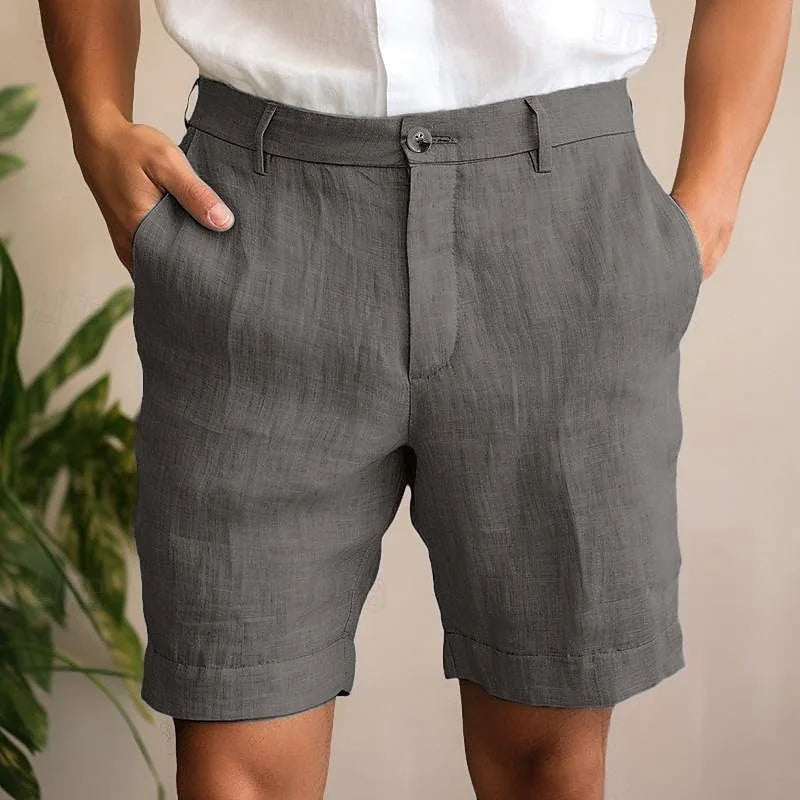 Close-up front view of charcoal grey linen shorts showing the button waist and visible stitching detail