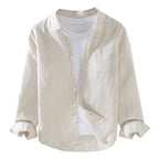 Cream linen shirt flat against a white background, showing the open collar and chest pocket stitching