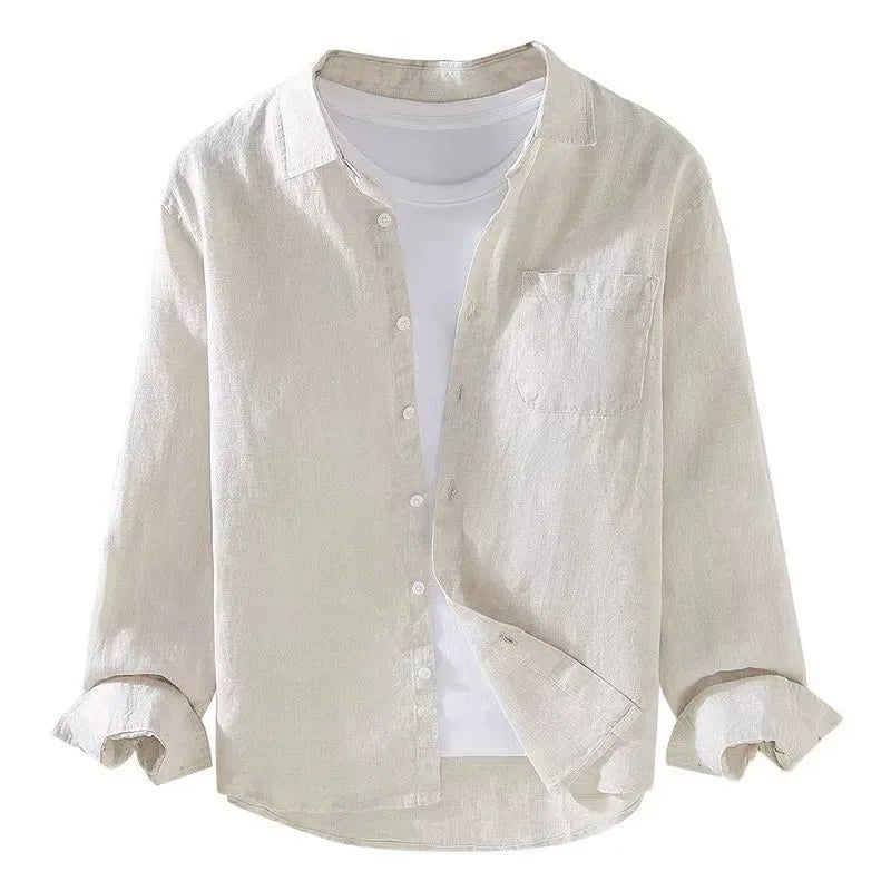 Cream linen shirt flat against a white background, showing the open collar and chest pocket stitching