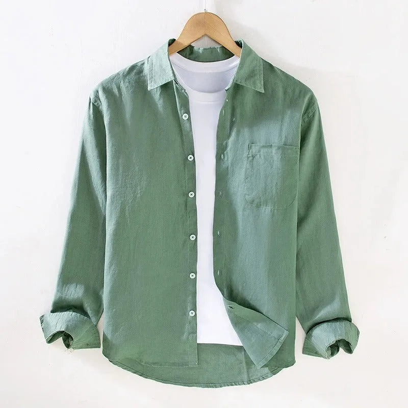 Green linen shirt on a hanger, full front view showing collar, buttons and relaxed fit over a white tee