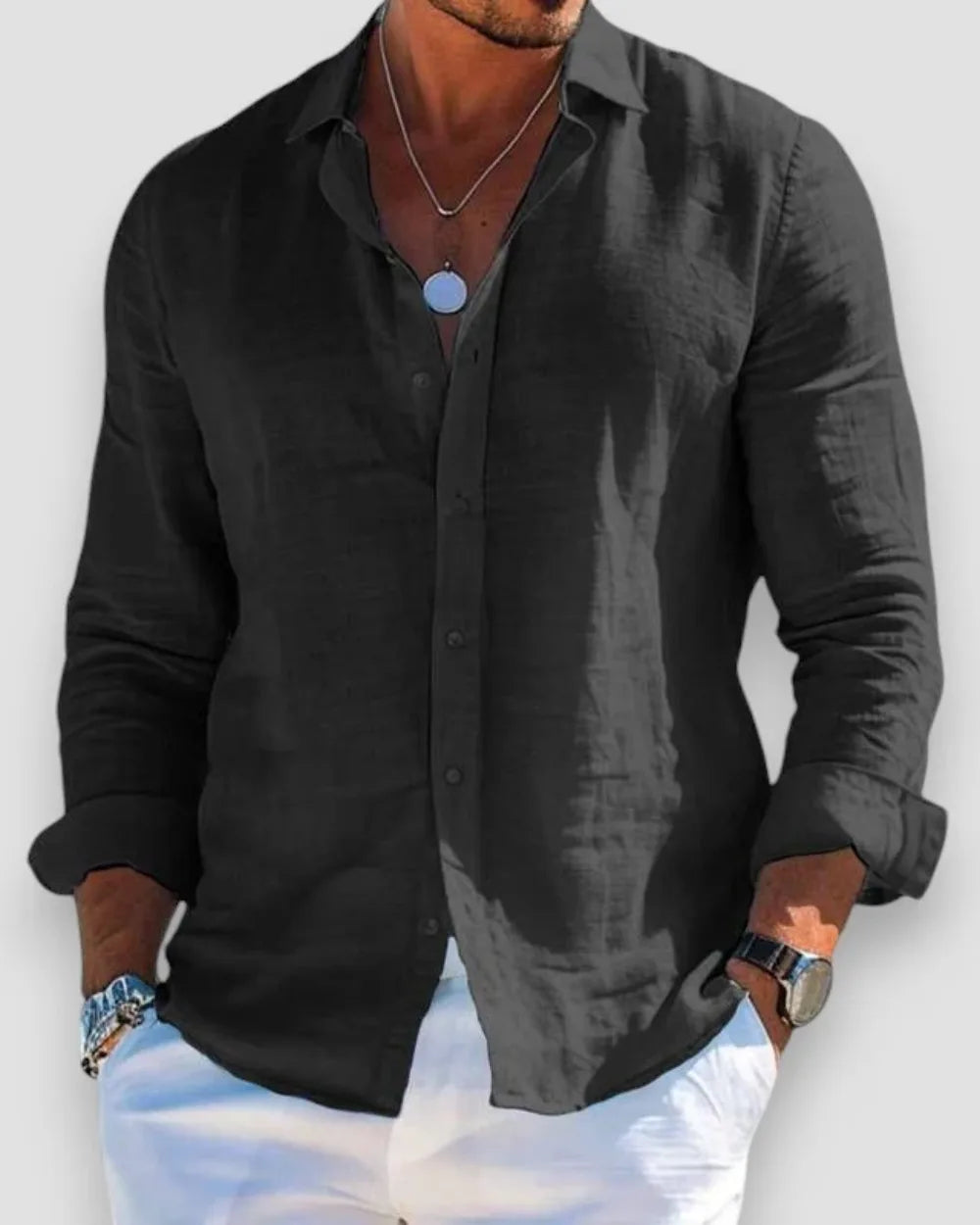 Black linen casual shirt with classic collar, buttoned front and cuffed sleeves on a male model