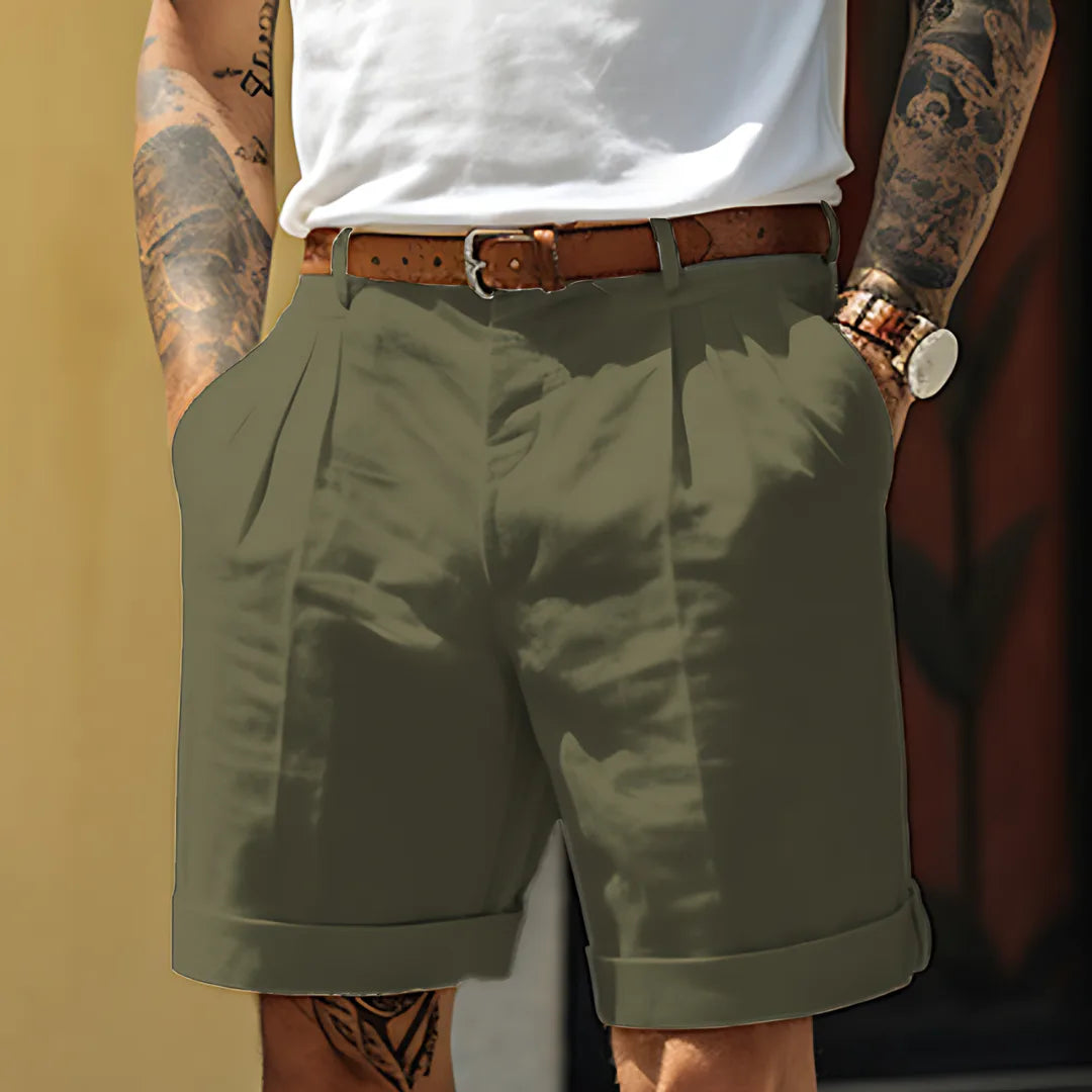 Khaki green tailored shorts with pleated front, structured waistband and rolled hem, front view