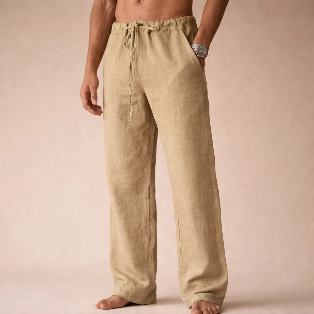 Front view of beige linen trousers with drawstring waist and slightly tapered straight leg