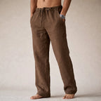 Front view of brown linen pants showing textured fabric weave and relaxed wide-leg cut