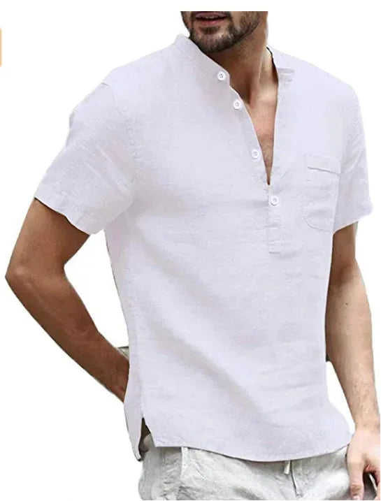 Close-up of a white linen short sleeve shirt with stand collar, button placket and chest pocket on a male model.