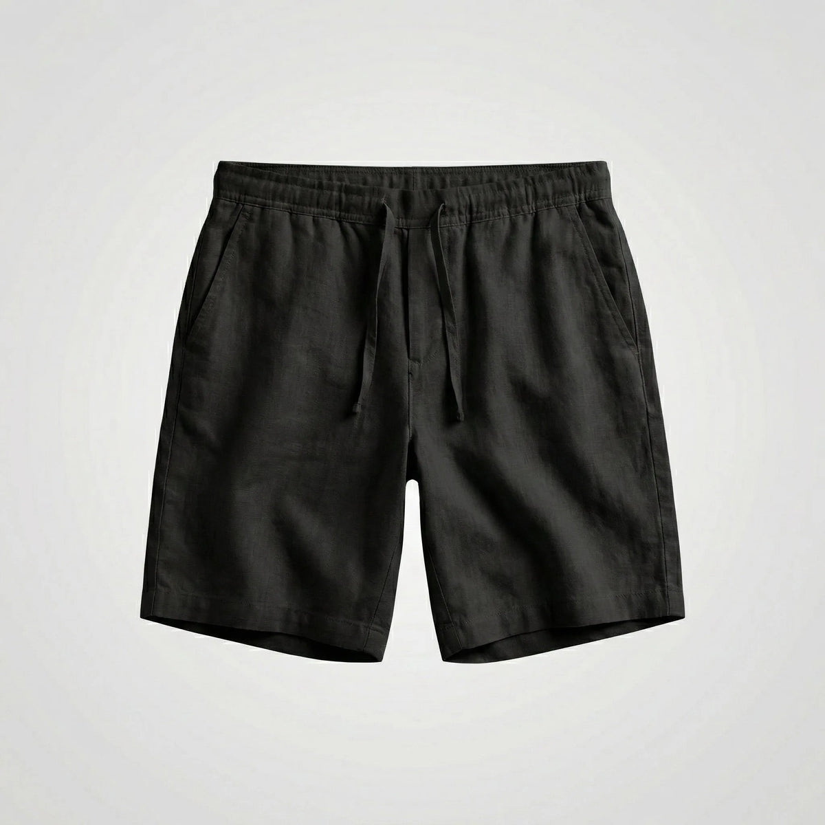Close-up of the side pocket opening on light blue linen shorts