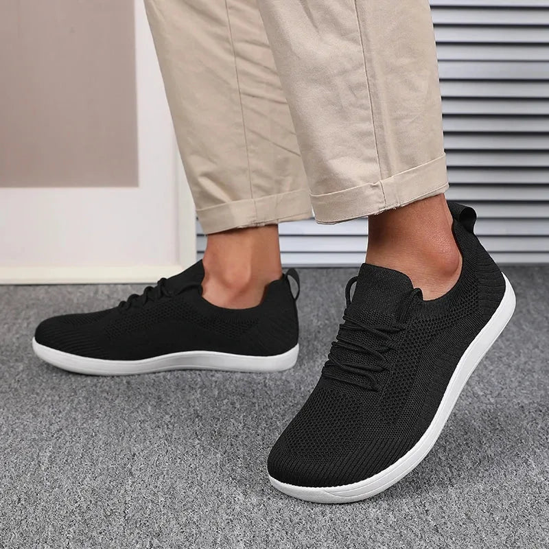 Light blue sneaker pair viewed from above showing matching knit uppers on both feet