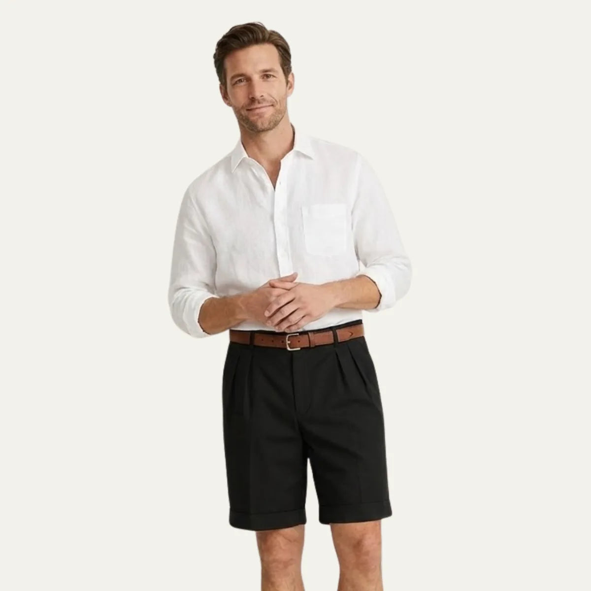 Side angle of pleated chino shorts showing the turn-up hem and tailored leg shape