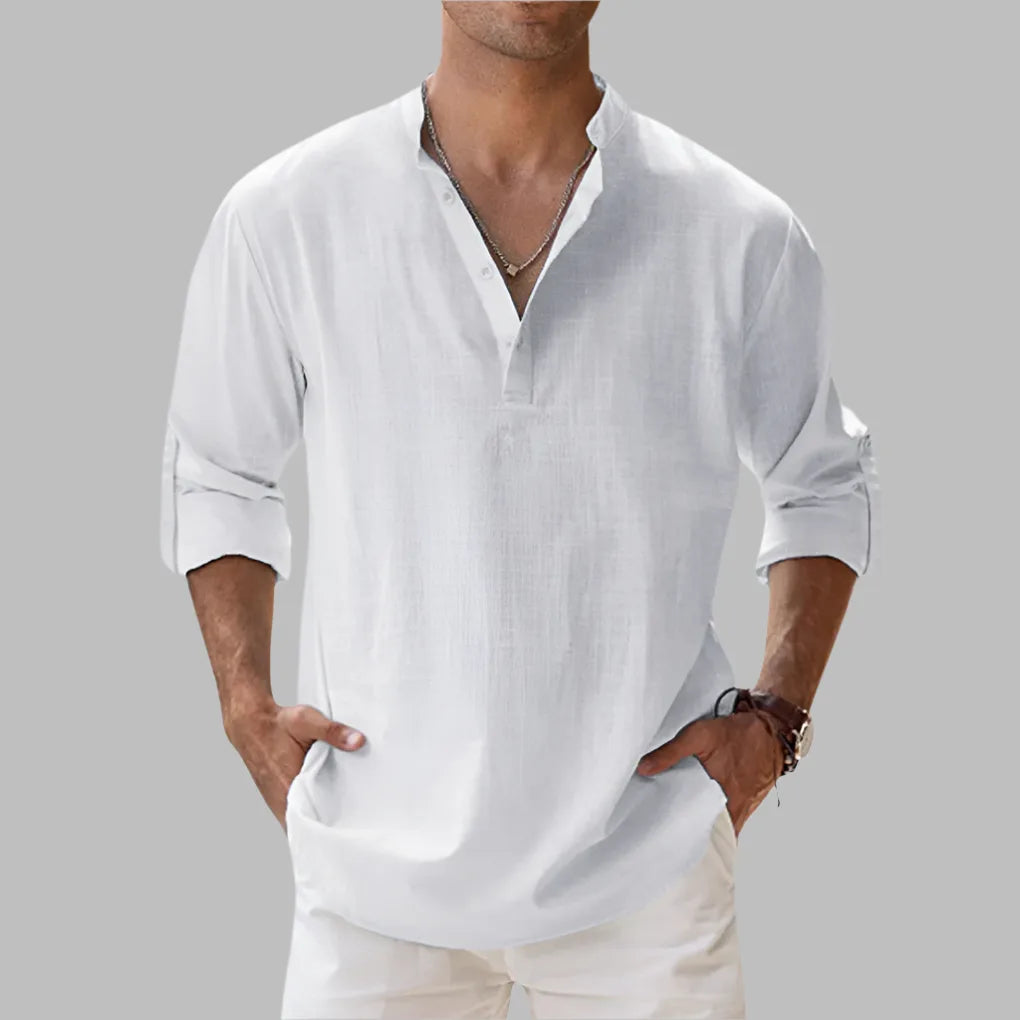 White linen shirt with notch collar and three-button placket, relaxed hip-length fit on male model