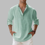 Sage green linen shirt with textured weave, notch collar and button-front, worn with white pants