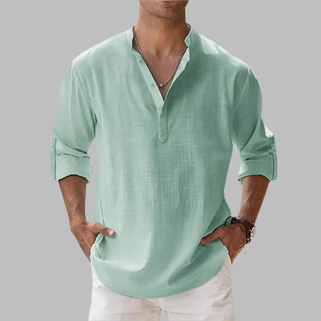 Sage green linen shirt with textured weave, notch collar and button-front, worn with white pants