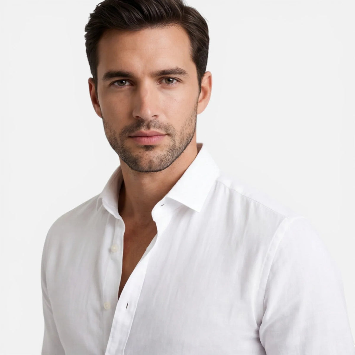 Close-up portrait showing white shirt collar and button placket against bare chest