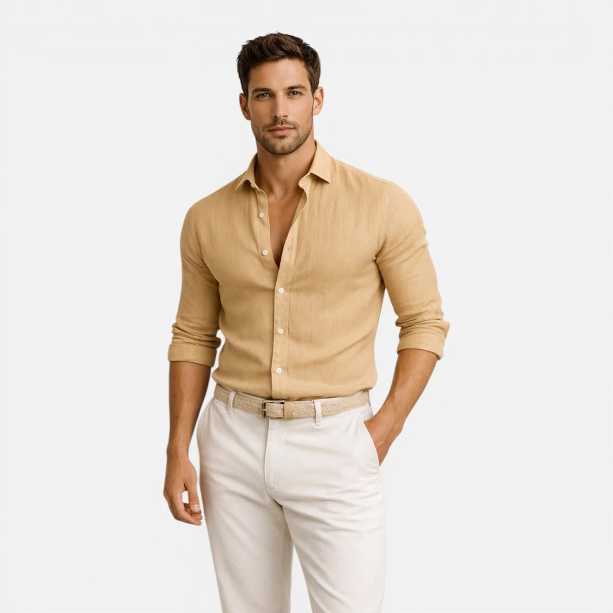 Man wearing beige linen cotton shirt tucked with woven belt and white trousers