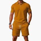 Close-up front view showing the textured fabric weave and three-button placket of the polo shirt.