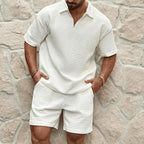 Front view of a white textured quarter-zip polo and matching shorts set with a classic collar