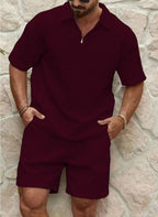 Front view of a burgundy textured quarter-zip polo shirt paired with matching tailored shorts