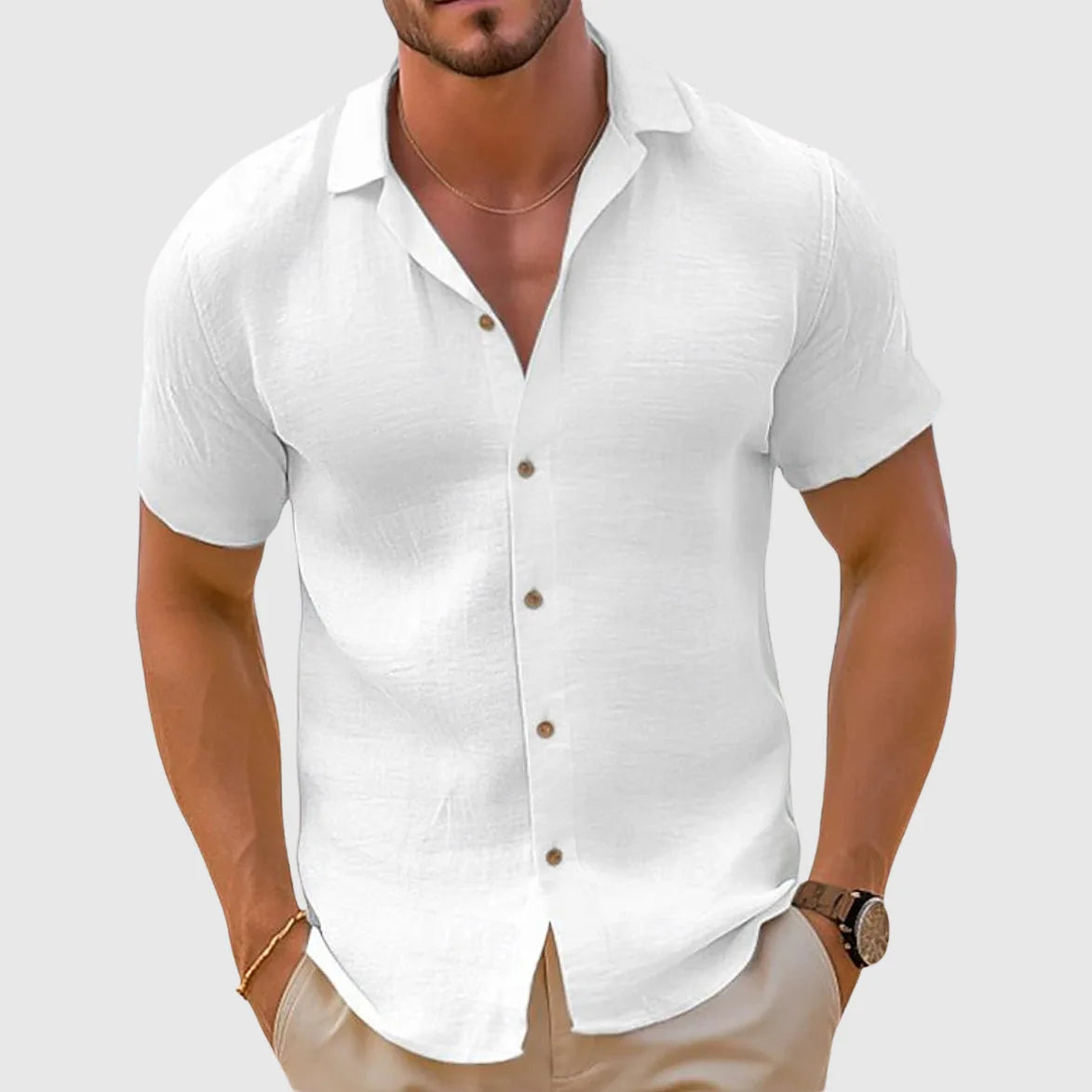 White woven short sleeve shirt with full button placket and curved hem, worn untucked
