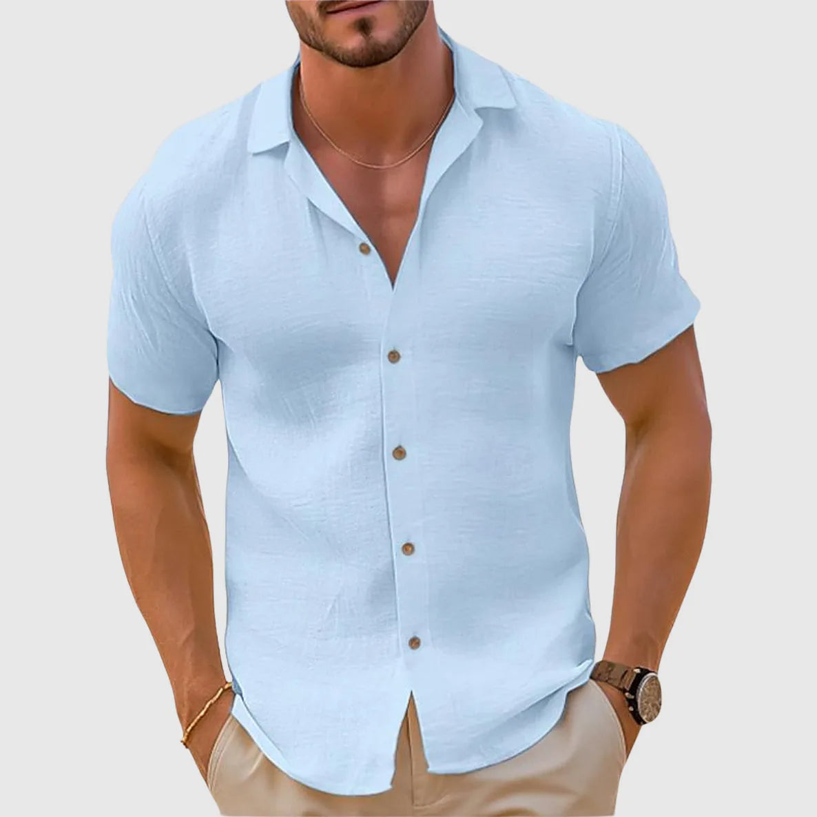 Light blue textured short sleeve shirt with turned cuffs and open camp collar