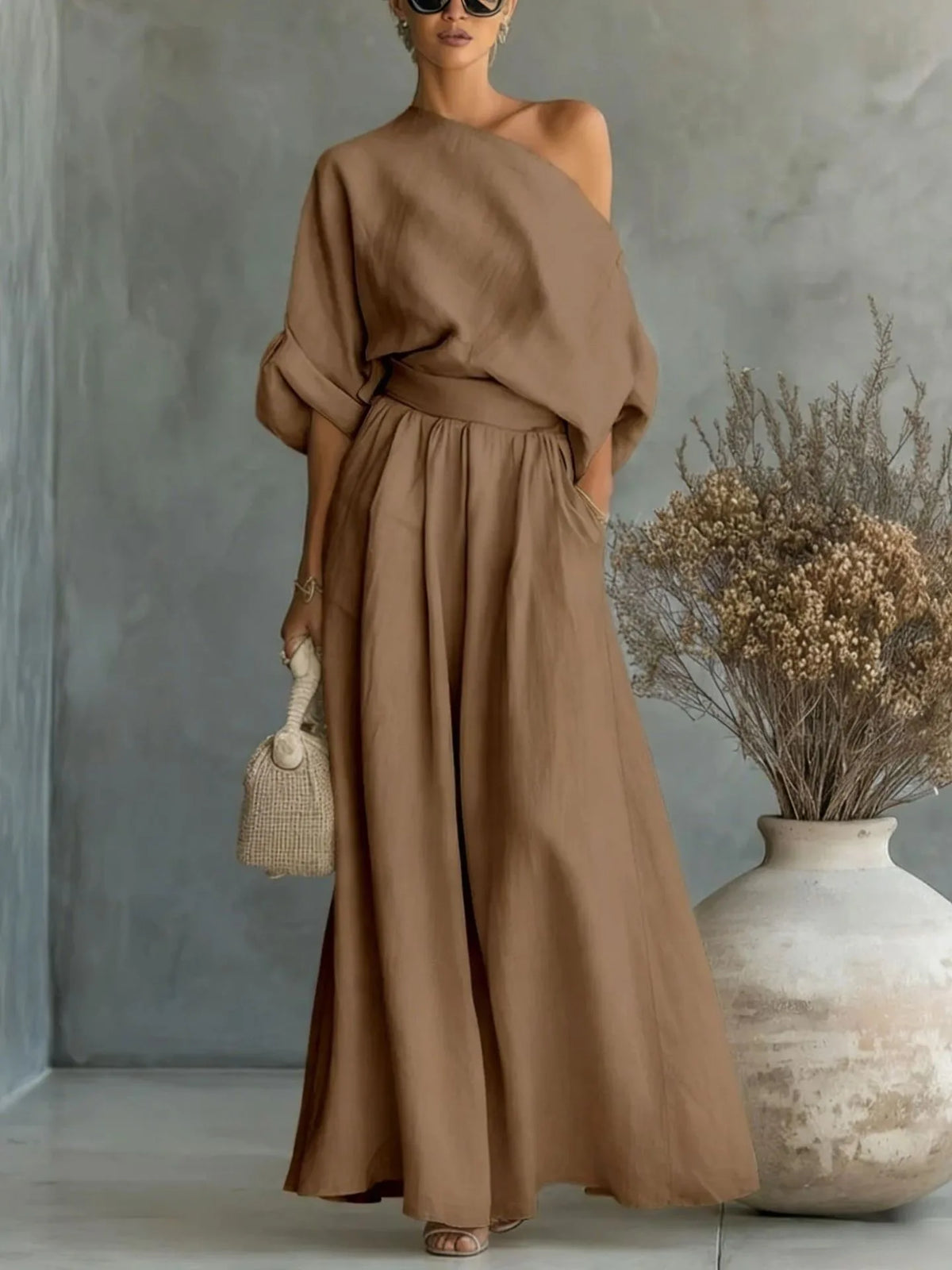 Back and side angle of the black maxi set showing the flowing skirt movement and relaxed drape