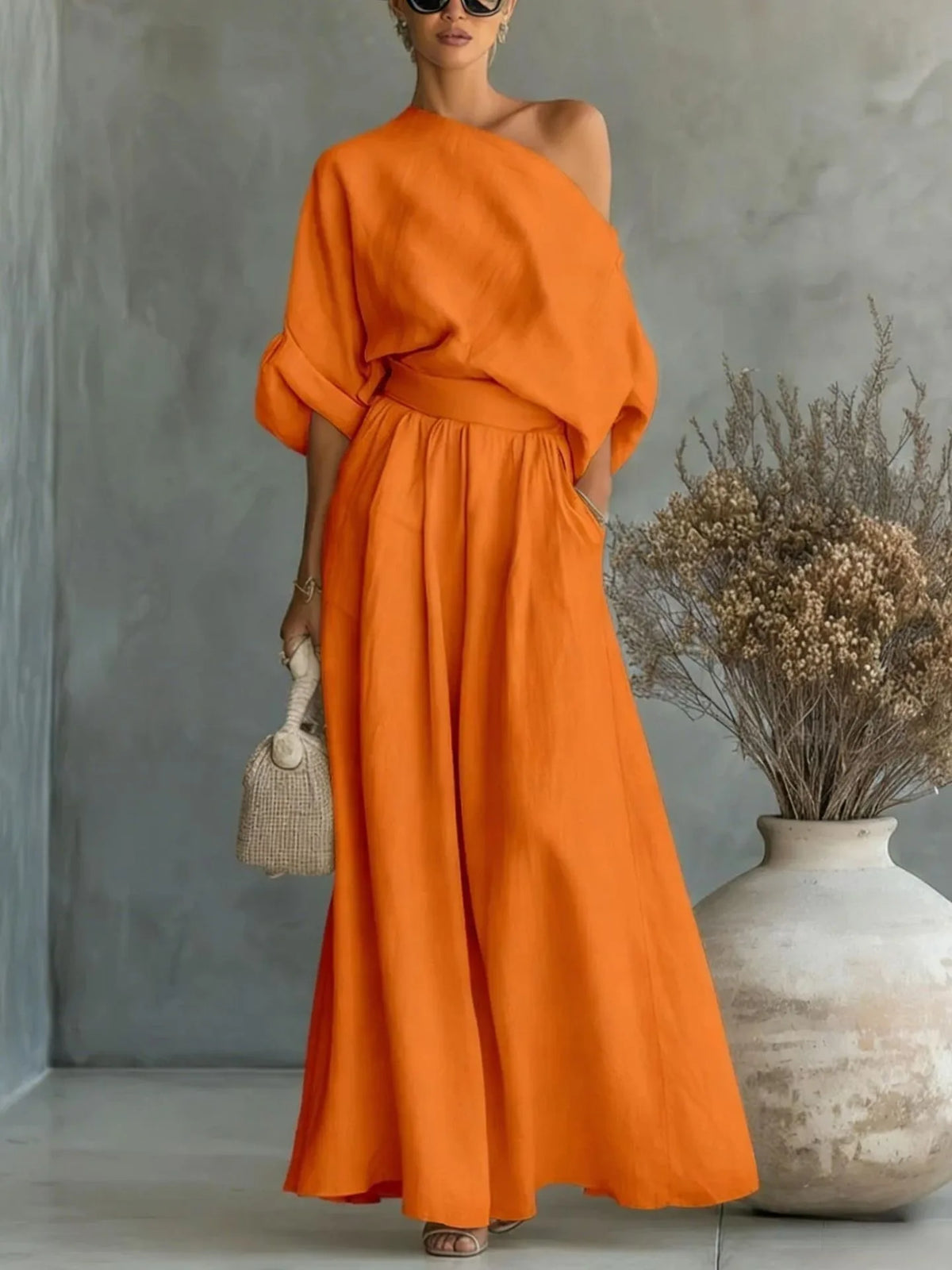 Detail shot of the gathered elastic waistband connecting the top and skirt pieces of the set