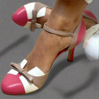 Side angle of pink, white and taupe colourblock heels showing the slim ankle strap and stiletto heel.