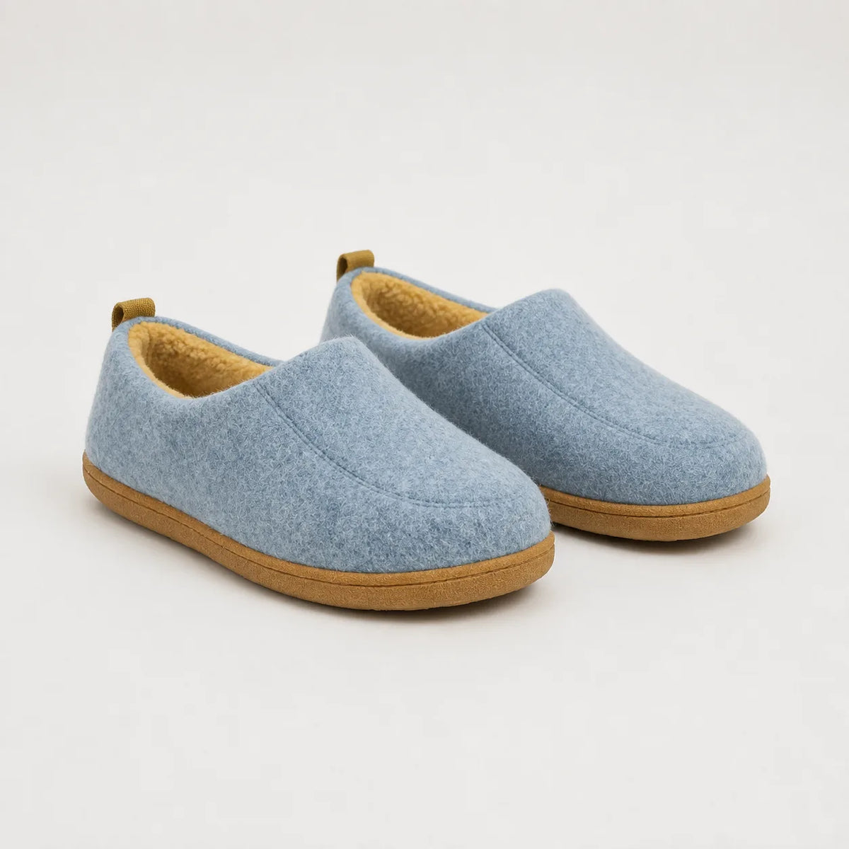 Pair of light blue felt slip-on slippers with mustard yellow fleece lining and olive pull tabs