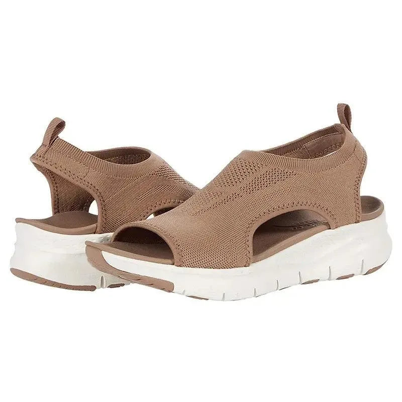 Tan brown knit slip-on sandals with stitched detailing and contrasting white platform outsole