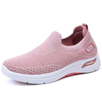 Angled side view of pink knit slip-on sneaker with white cushioned sole and ComFort logo detail on heel