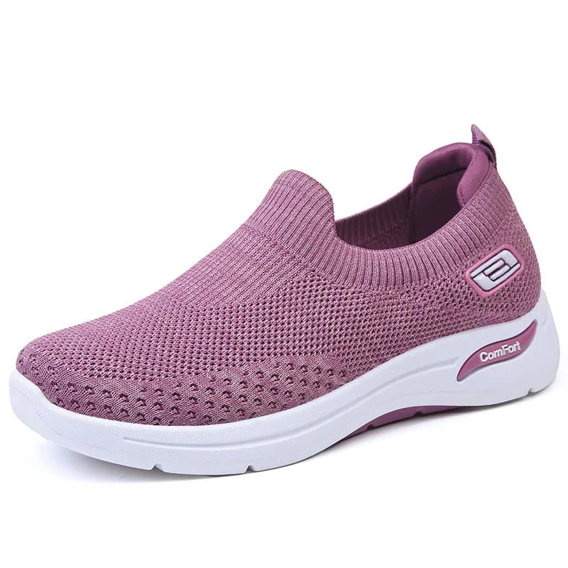 Side profile of mauve purple knit slip-on sneaker showing ribbed collar and chunky white outsole