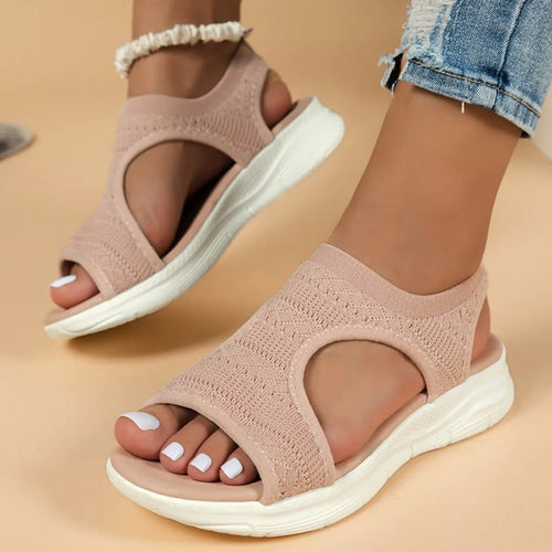Pink knitted sport sandals with cut-out detailing, worn with cropped denim and shell anklet