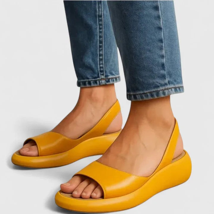 Front angle of navy platform sandals showing the wide toe opening and elasticated heel strap